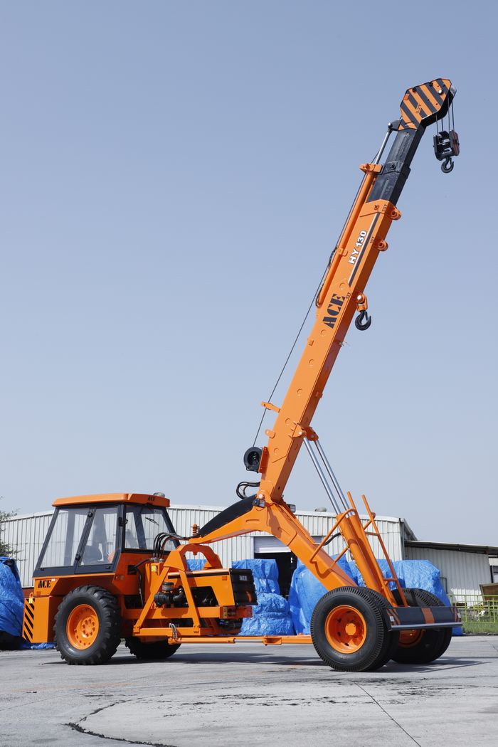 About High-angle view of ACE HY130 crane at a sunny construction site in Faridabad.